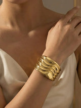 Elegant Comet Gold Wavy Wide Cuff Statement Bangle - Doulaat