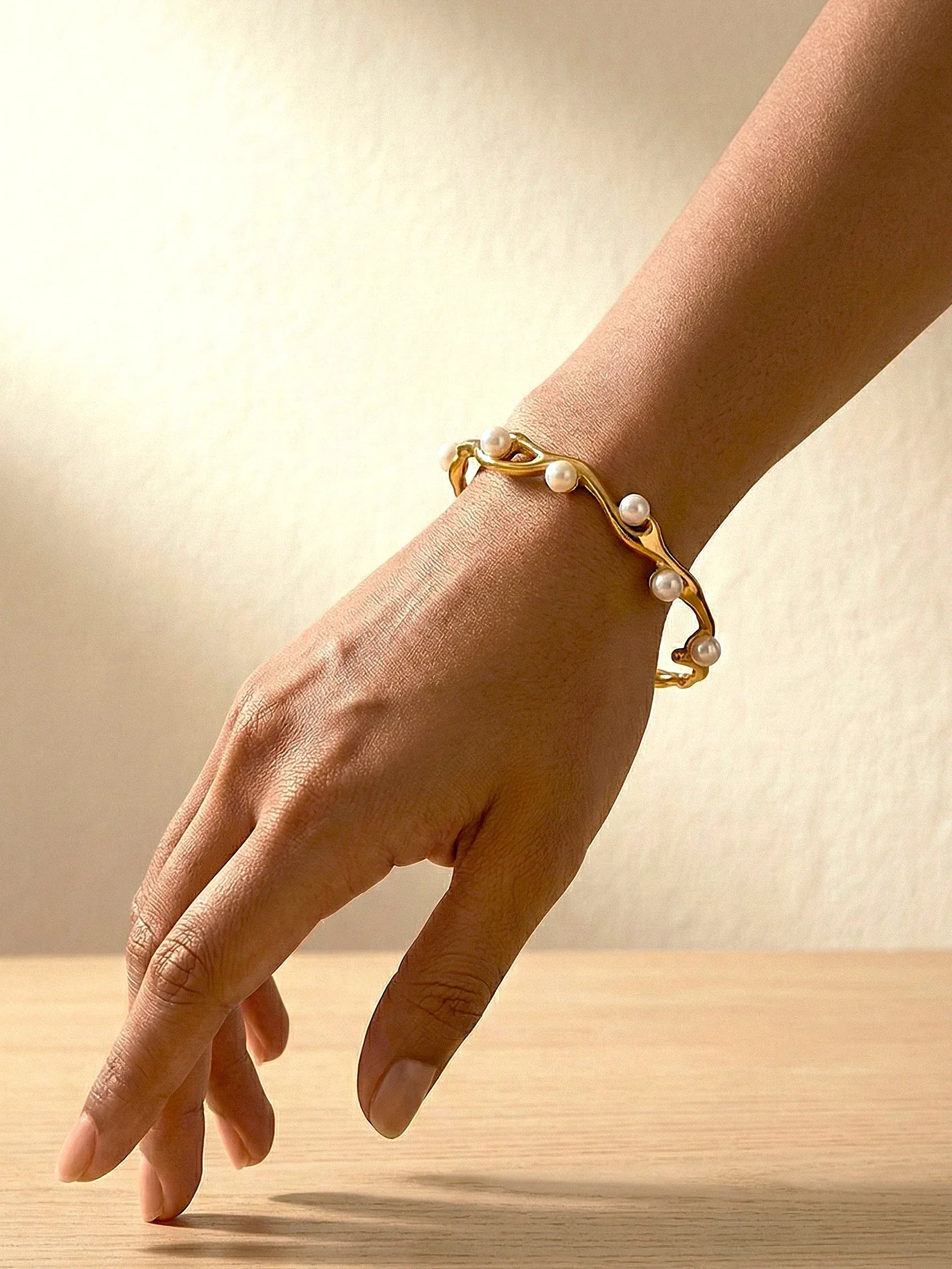 Elegant Branchlit Bangle with Gold Finish and Pearls - Doulaat