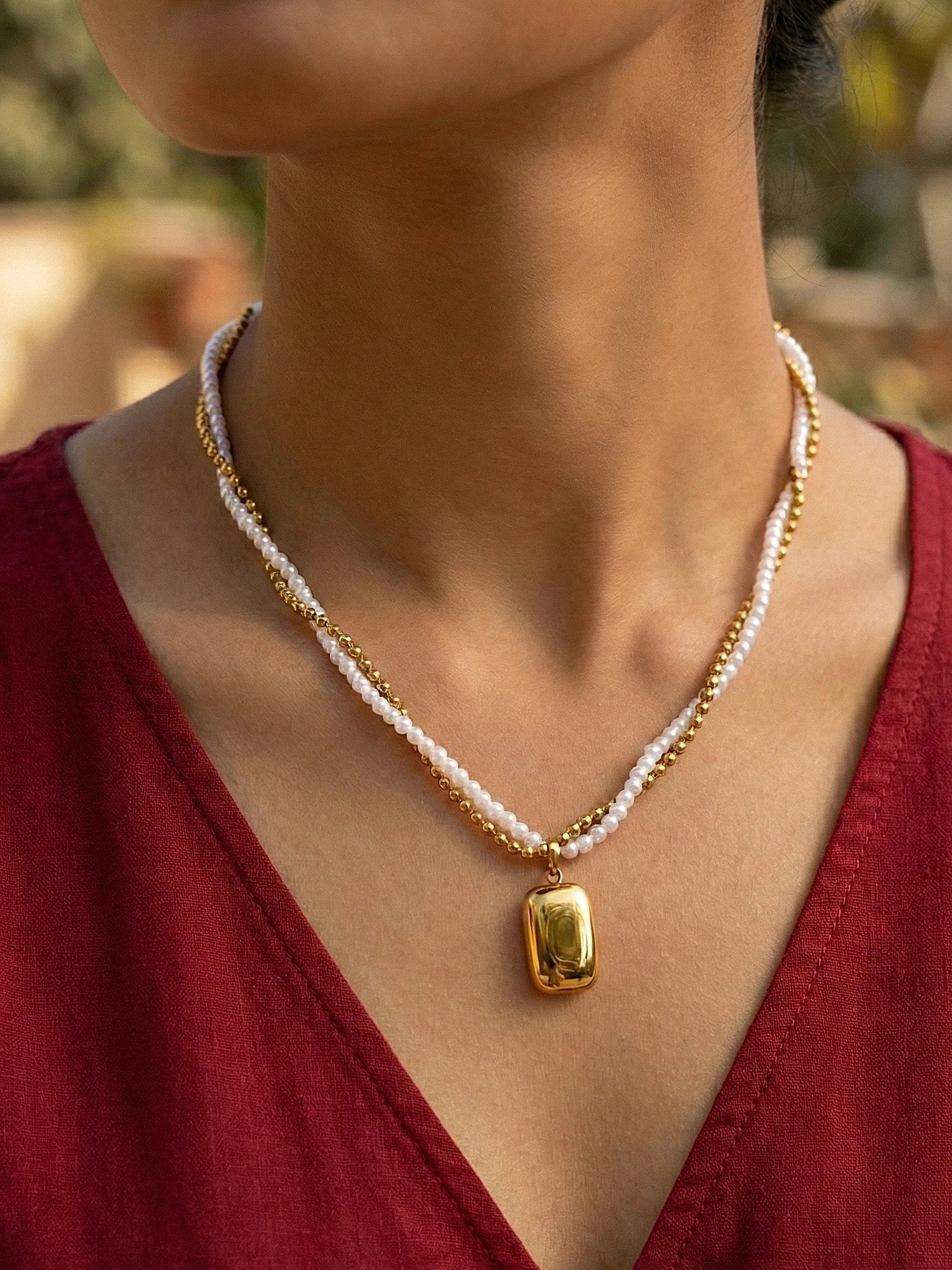 Elegant Gold Layered Chain Necklace with Shiny Pearl - Doulaat