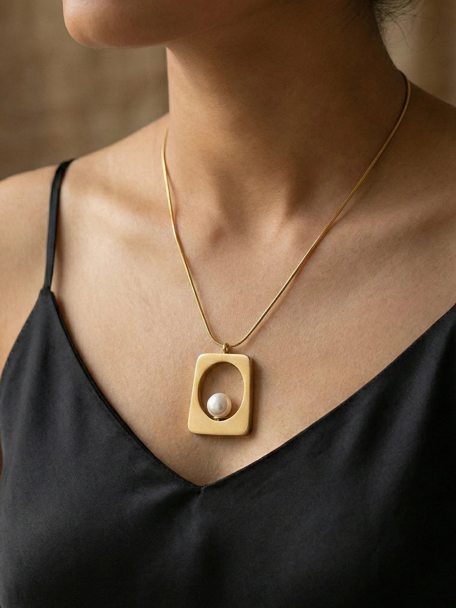 Gold Trapezoid Pendant with Elegant White Pearl - Doulaat