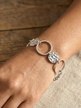 Silver Sunburst Circle Bracelet with Textured Disc Design - Doulaat