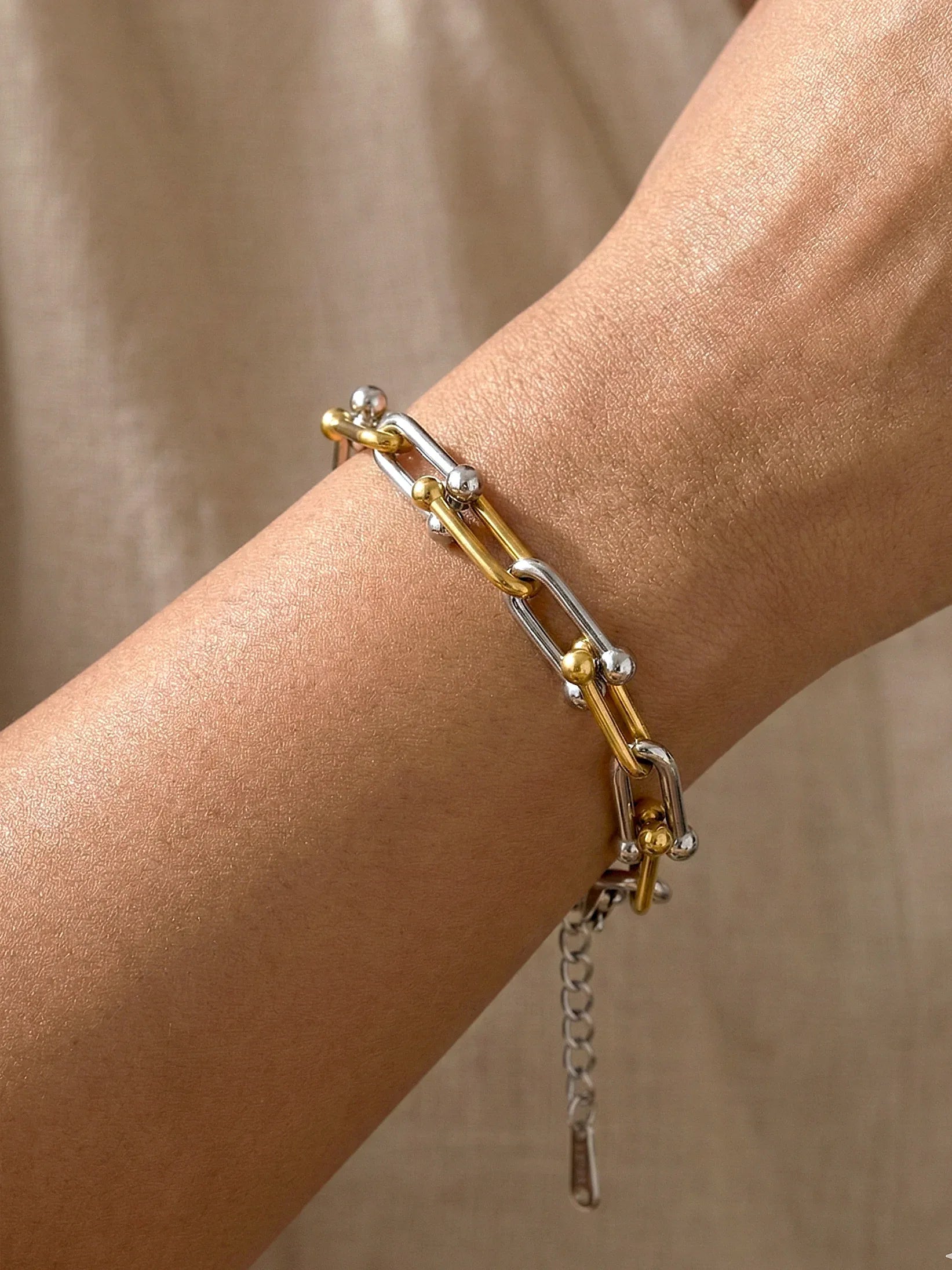 Elegant Silver Serenelle Bracelet with Gold Link Accents - Doulaat