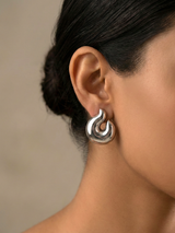 Aura Knot Silver Stud Earrings with a Smooth Modern Shape