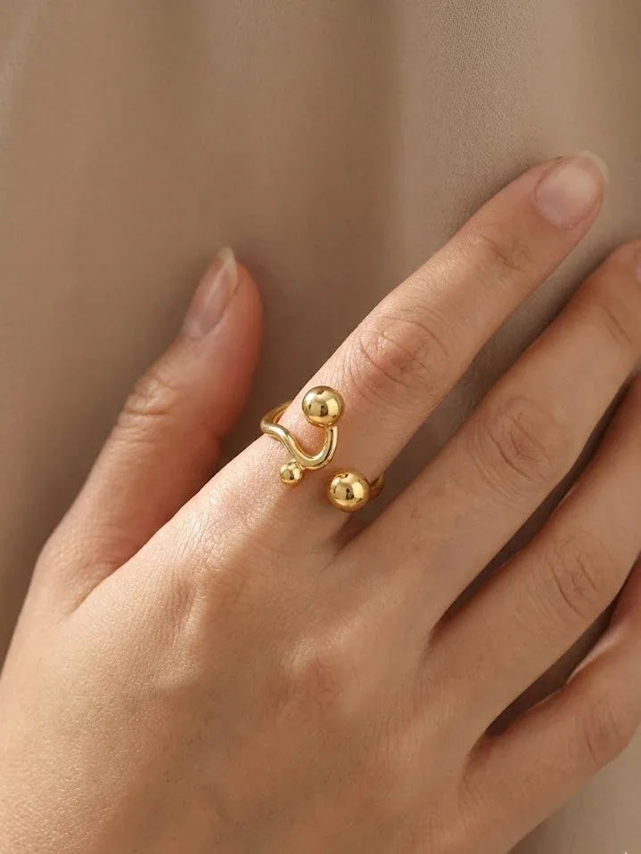 Elegant Gold Sphere Ring with Modern Open Cuff Design - Doulaat