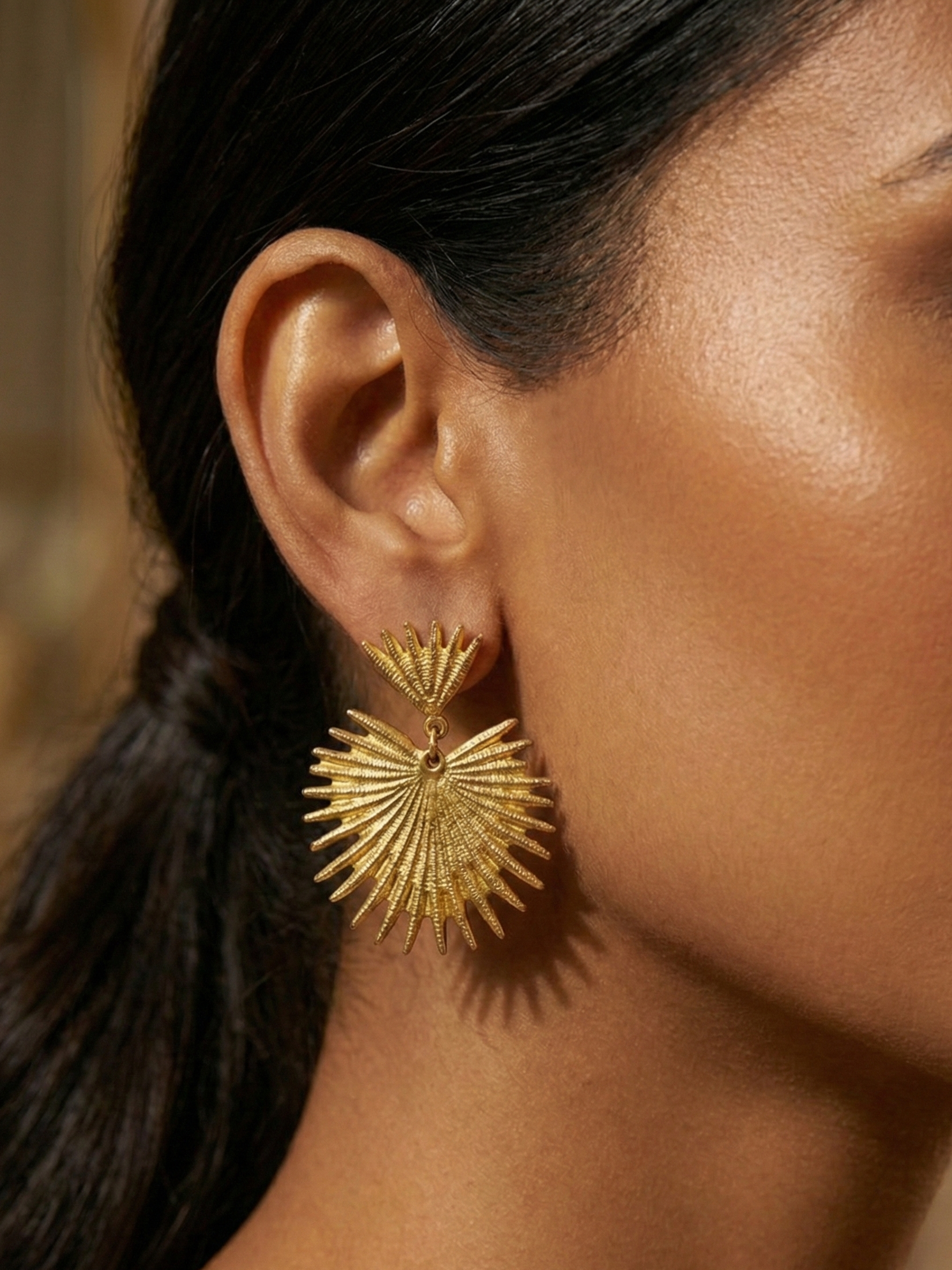 Golden Sunburst Earrings with Sparkling Center Stone