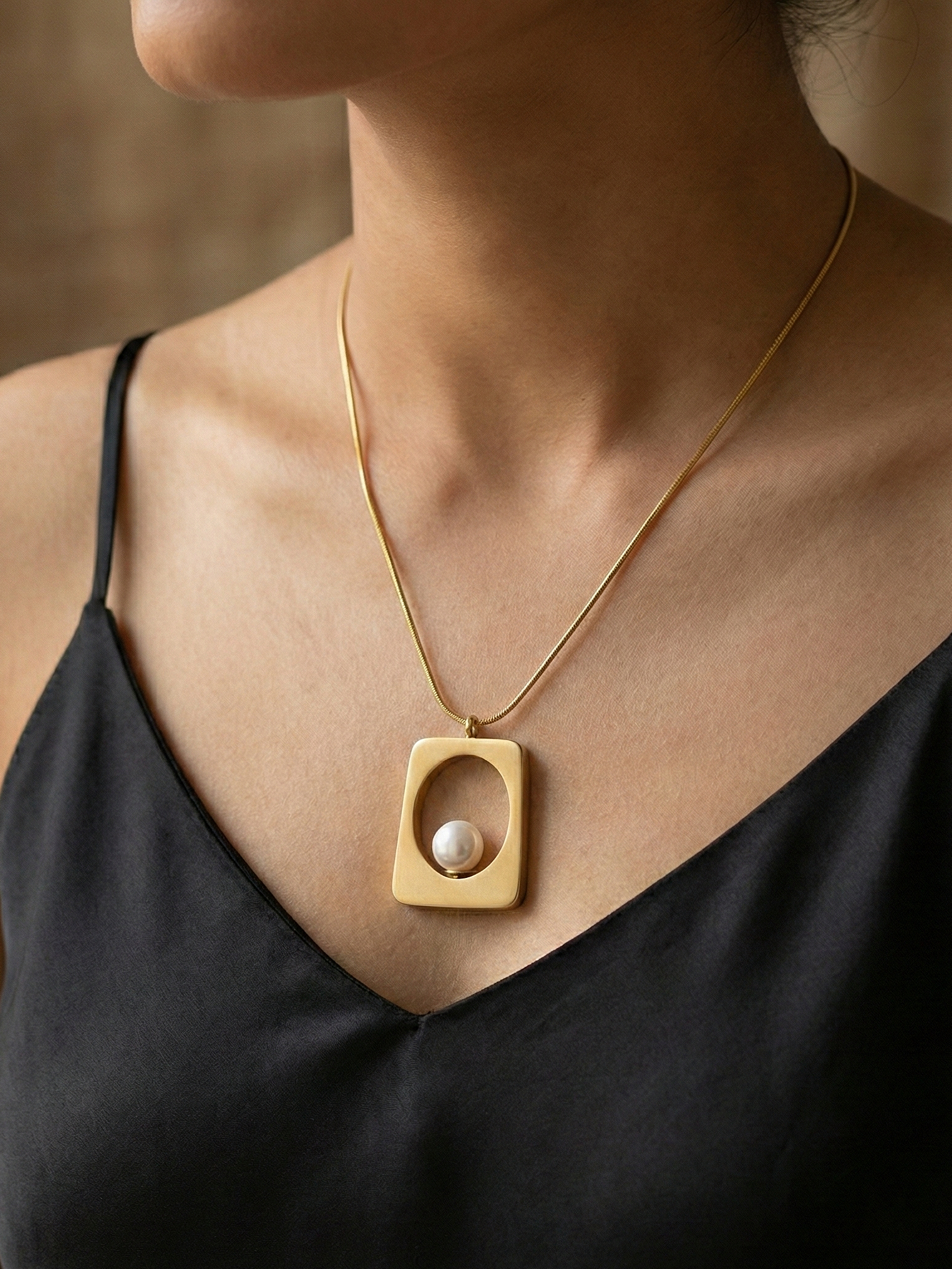 Gold Trapezoid Pendant with Elegant White Pearl